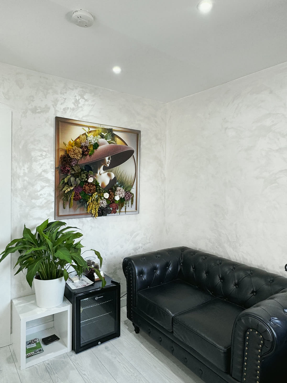 Quiet corner with a chesterfield sofa and plants